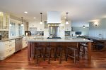 Kitchen with high end finishes and additional bar height seating